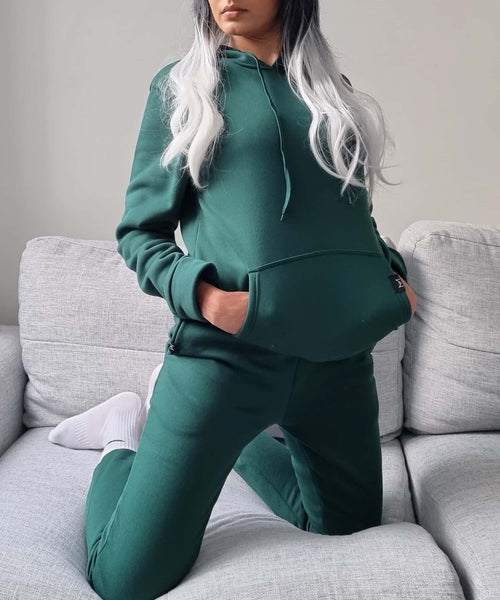 Olive green hoodie Australian fashion designer. fashion week in a hoodie. Misha world hoodie. casual stay home. til Tok trends. work from home outfit.