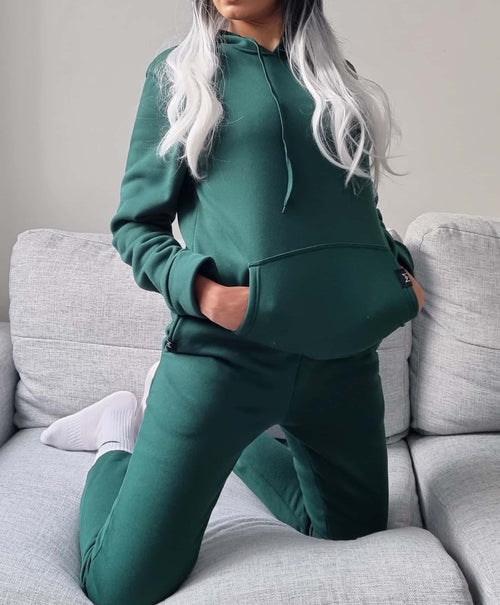 Olive green hoodie Australian fashion designer. fashion week in a hoodie. Misha world hoodie. casual stay home. til Tok trends. work from home outfit.